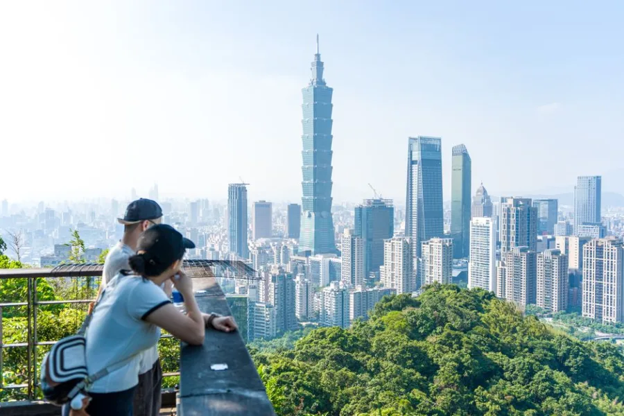 People enjoying scenic view of Taipei 101 and city skyline from Elephant Mountain.